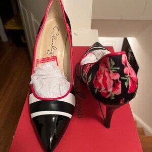 Heels by Charly Amar that combine bold stripes and blooms! Women's size 8.5